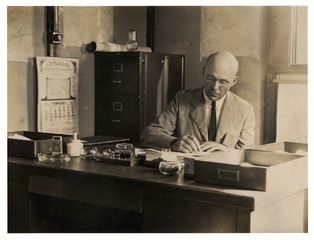 Wilbur A. Sawyer at the village office of the Yellow Fever Laboratory in Yaba, Nigeria