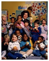 U.S. Surgeon General Antonia C. Novello in group photo with children at a daycare center