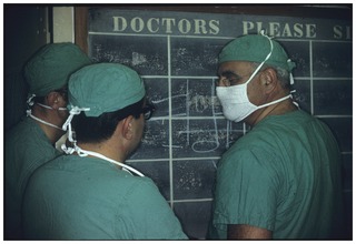 Doctors in front of doctor's board, pre-op