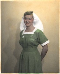[Nurse wearing uniform from Uganda]