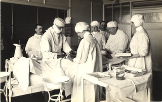 [King George Military Hospital, 4th floor theatre group, Dr. Murrison operating]