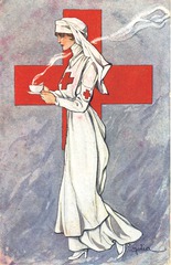 [A nurse serving a hot drink in a cup]