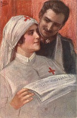 [A military nurse reading the newspaper to an officer]