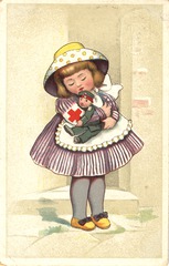 [Little girl hugging a soldier doll]