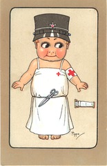 [Child wearing red cross helmet and gown]