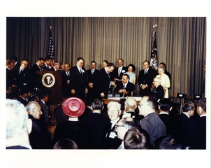 [President Lyndon Johnson signs the 1965 Medicare Bill 2]