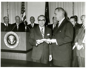 [President Lyndon Johnson receives report of the President's Commission on Heart Disease, Cancer and Stroke]