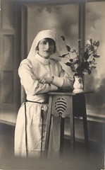 [Nurse with a vase of flowers]