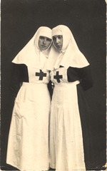 [Two Latvian nurses standing side by side]