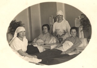 [Two Latvian nurses with patients]