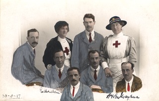 [Group photo of two Red Cross nurses and six convalescing soldiers]