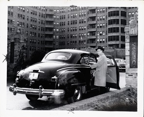 John E. Fogarty with his car outside the Shoreham Apartments