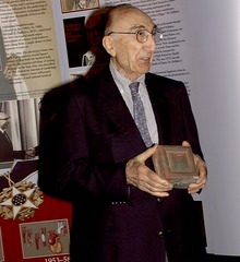 Michael DeBakey opening and displaying his gift at his 90th birthday party at NLM (image 2)