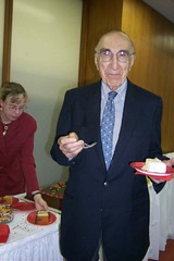Michael DeBakey enjoying cake at this 90th birthday celebration at NLM