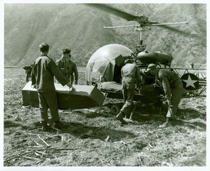 Final preparations made for evacuation of a wounded man to the 1st Mobile Army Surgical Hospital, Chechon, Korea